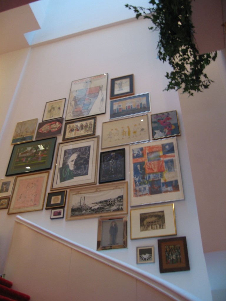 eclectic gallery wall stairs