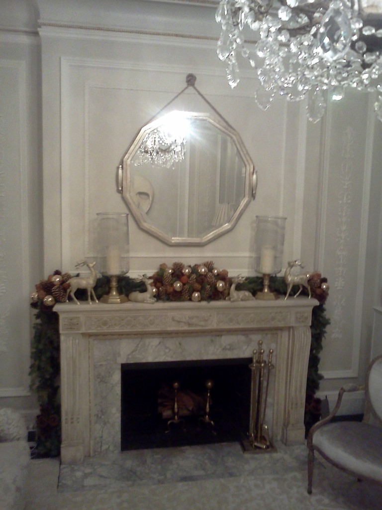 hanging mirror above fireplace