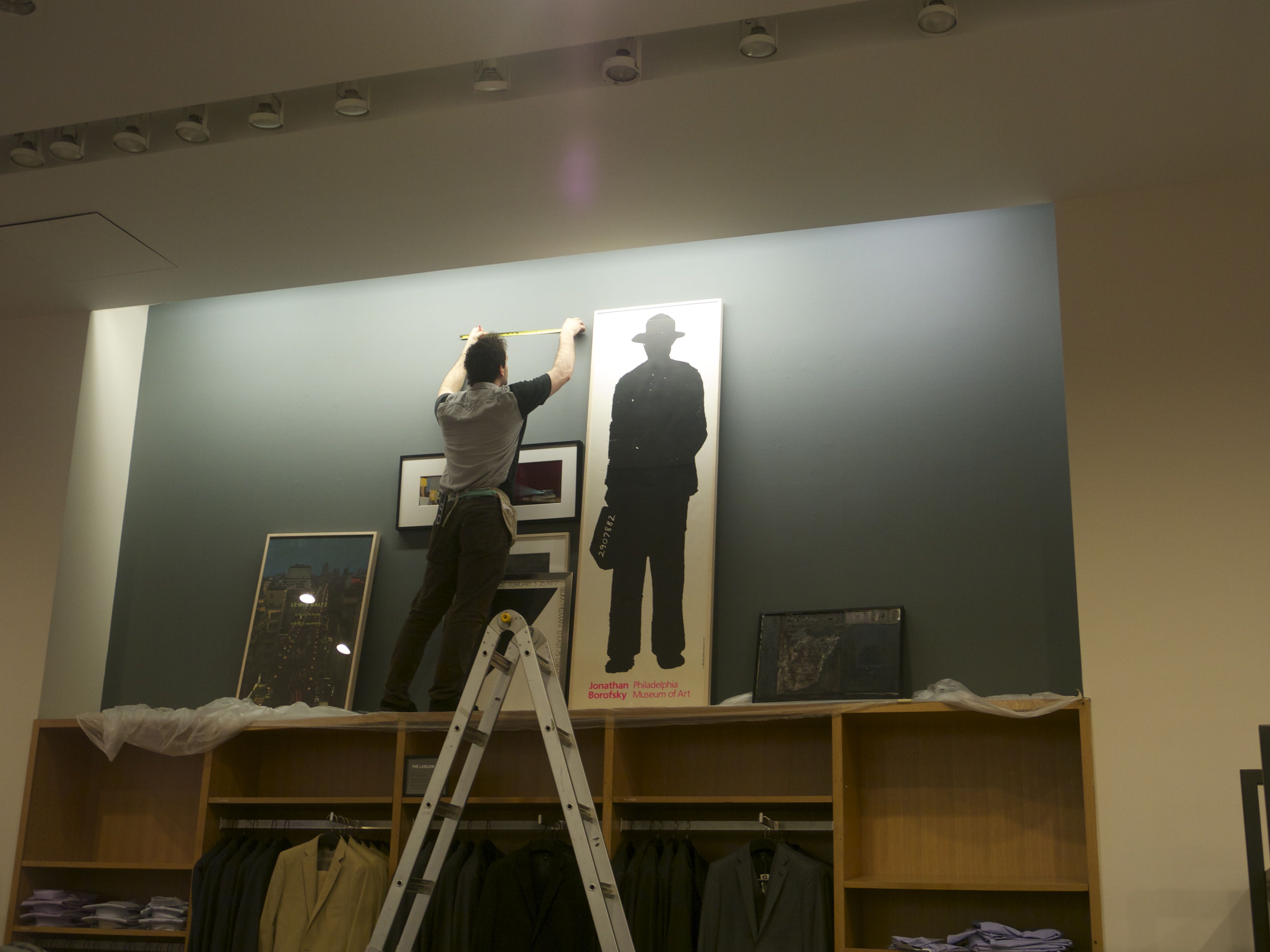 installing art in a retail store