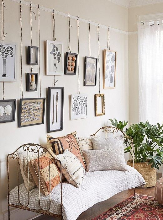 Hanging photographs 2024 on wall