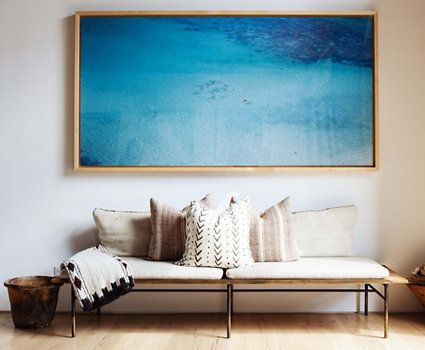 According to Feng Shui, one statement piece is better than a gallery wall. Image via One King's Lane.
