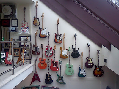 guitars hung on a wall