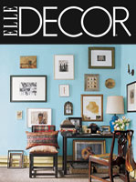 Photo of Elle Decor magazine, cover photo is of a bright blue room covered in small frames