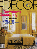 Photo of Elle Decor magazine, cover photo is of a neat yellow bedroom and headline reads Decorating Downtown