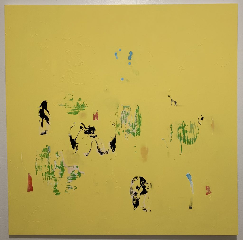 An abstract painting in yellow with splashes of additional color