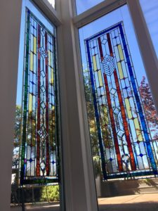 Best art installation company hangs a stained glass window