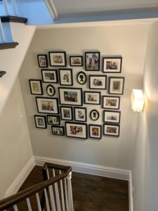 family photo wall in stairwelll