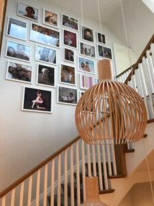 family photo wall in a staircase