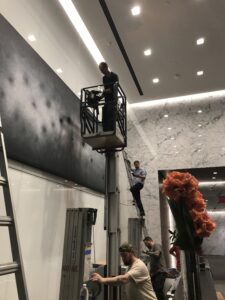 artwork being installed by NYC's best art installation service