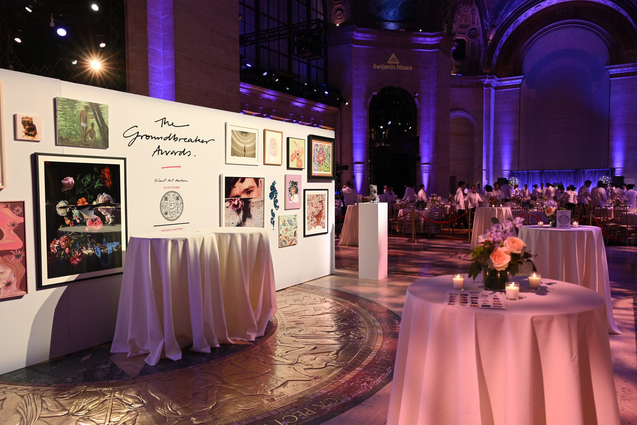Silent auction art wall at the Housing Works Groundbreaker Awards Gala at Cipriani 25 Broadway