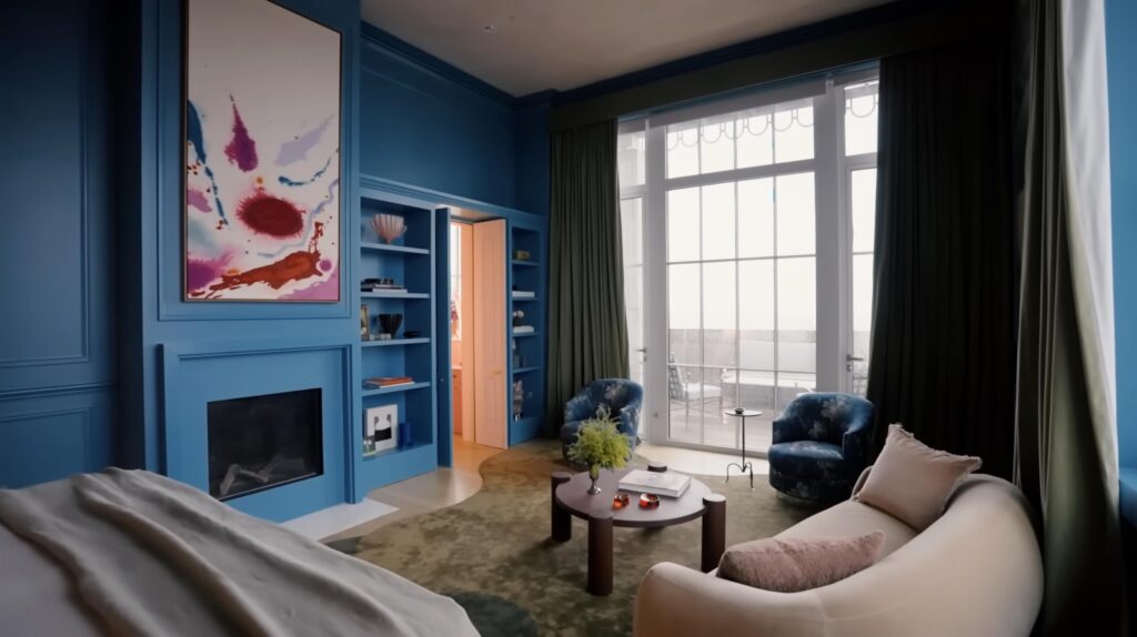 Painting above fireplace in the blue primary bedroom of Kate Upton and Justin Verlander's NYC penthouse, designed by John Ruggiero