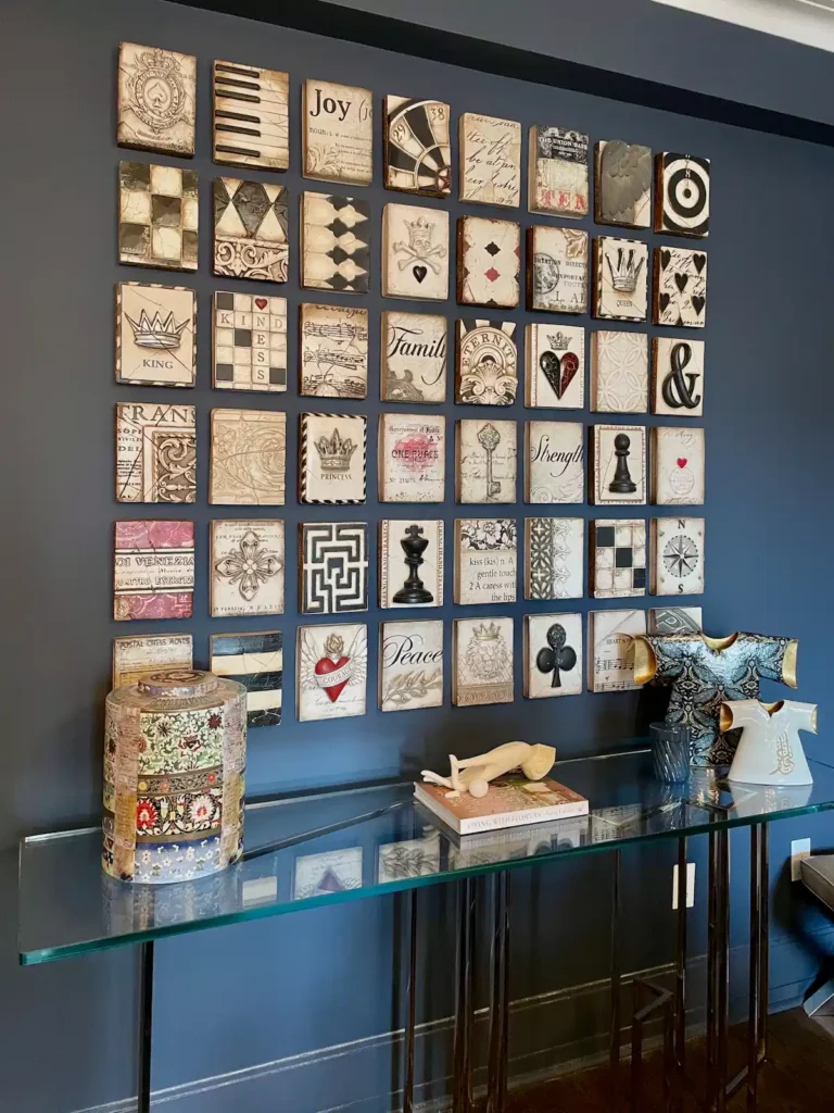Completed grid of decorative tile panels installed on a dark blue wall by ILevel Art Installation