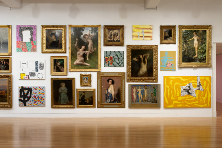 Salon style art installation comprising old and new paintings