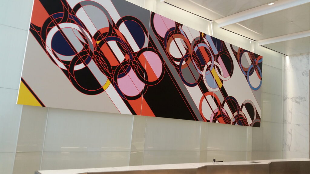Large-scale commissioned mural installed above the reception desk in a New York commercial building lobby